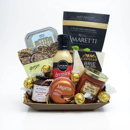 Kelowna Baskets gluten-free gift set featuring artisanal snacks, sauces, brie cheese, and chocolates in a tray.